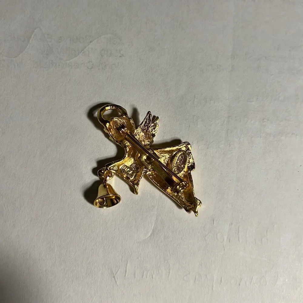 Faux gold angel with bell pin.